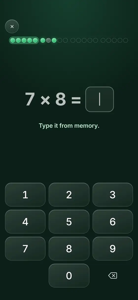 The same card a moment later: 7 × 8 = with an empty answer box and the line Type it from memory.